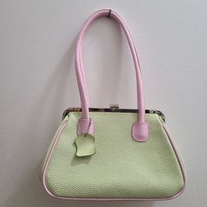 Green and pink faux leather purse